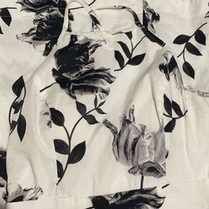 White halter dress with black floral pattern